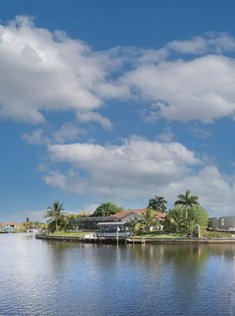 Aerial view of a Southwest Florida waterfront community with canals and homes