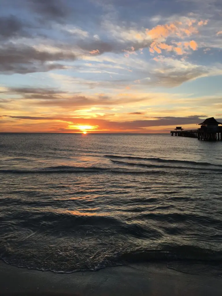 Naples Pier at sunset over the Gulf of Mexico in Southwest Florida