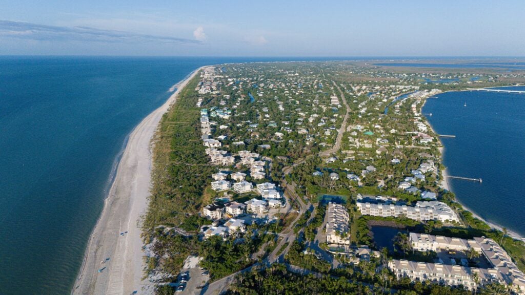Aerial view of Sanibel Island coastline and waterfront homes