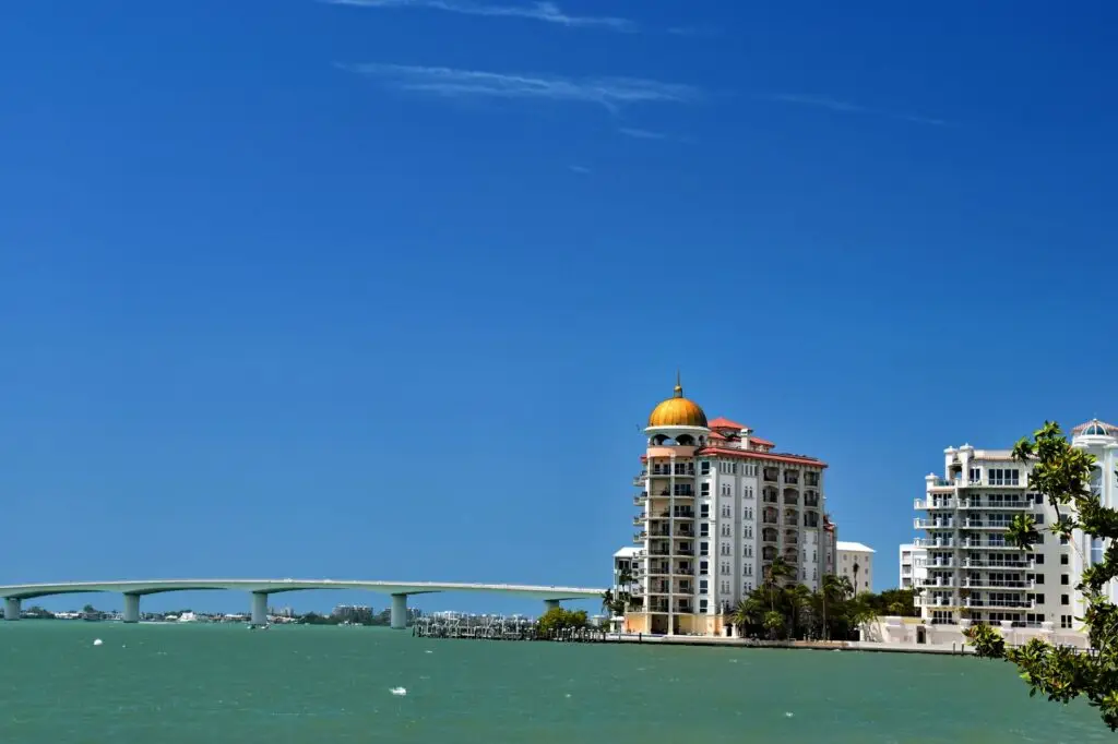 Waterfront view of the Sarasota skyline and bridge under a clear blue sky in Florida