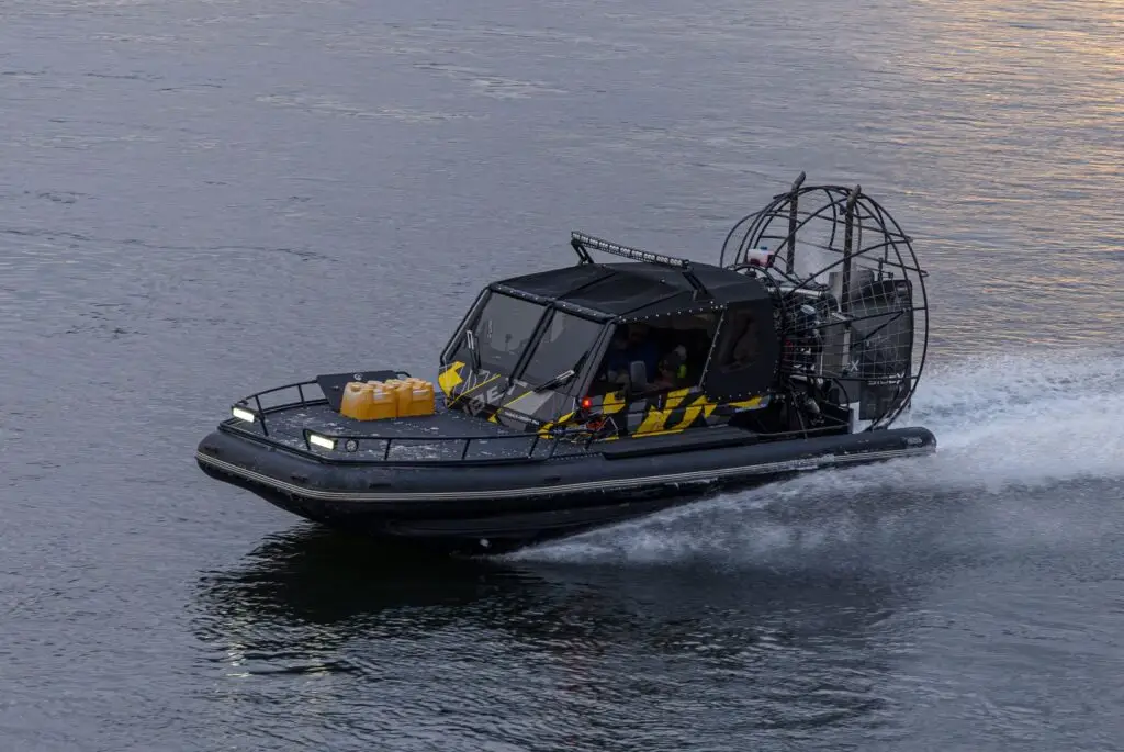 Airboat gliding across shallow water in the Florida Everglades
