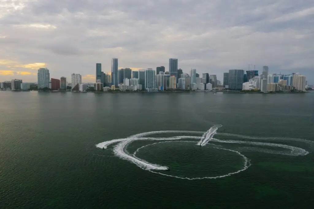 Aerial view of the Miami skyline with boats on the ocean in Florida